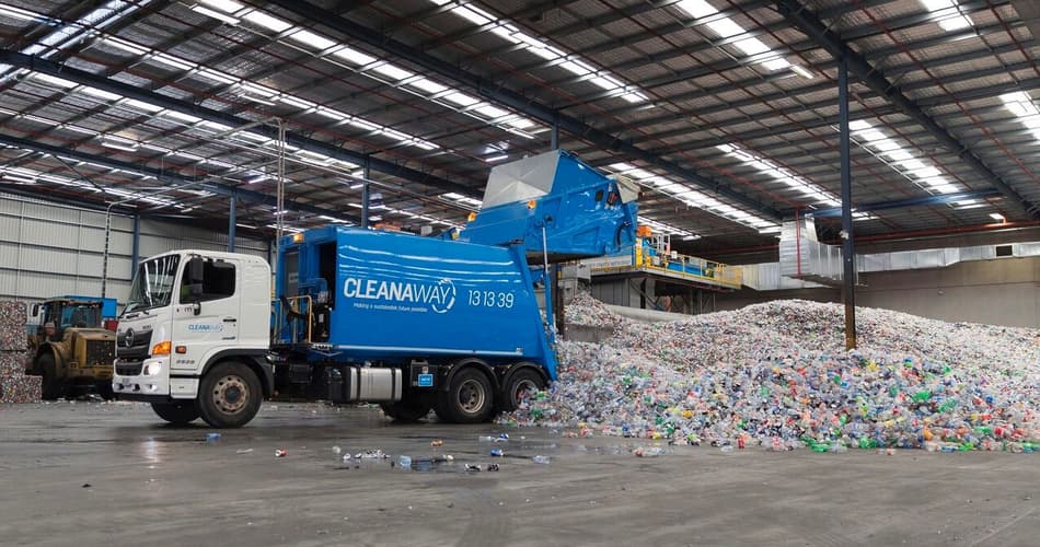 Cleanaway truck emptying plastic bottles